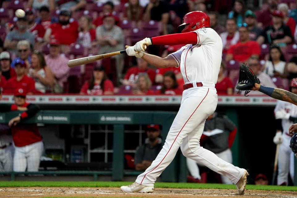 Cincinnati Reds third baseman Brandon Drury (22) hits a three-run home run in the fifth inning of a baseball game against the Milwaukee Brewers, Monday, May 9, 2022, at Great American Ball Park in Cincinnati. 