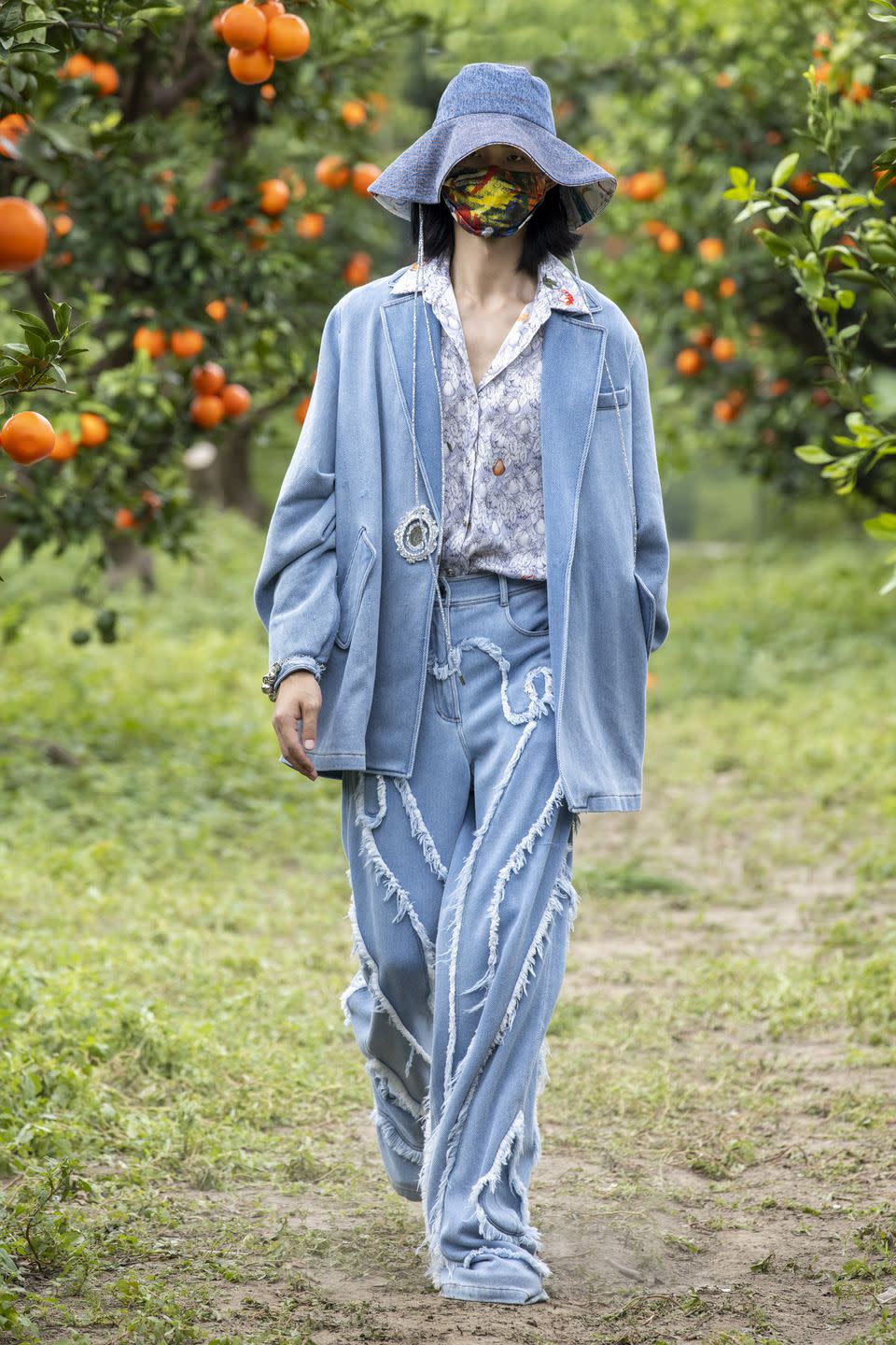 <p>Mithridate’s SS22 collection entitled 'The Mirror Stage' was shot in a mirrored orange orchard in Shanghai, but presented to audiences through a digital experience. Founder and creative rirector Demon Zhang was inspired by the psychoanalytic theory by Jacques Lacan, based on the belief that a child’s personal apperception of oneself develops at six months old, establishing the recognition of themselves in a mirror and thereafter introducing the formation of the ego.</p>