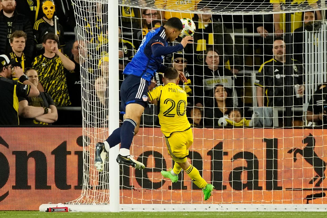 May 11, 2024; Columbus, OH, USA; FC Cincinnati defender Kevin Kelsy (19) scores a goal on a header over Columbus Crew midfielder Alexandru Matan (20) during the second half of the MLS soccer game at Lower.com Field. The Crew lost 2-1.