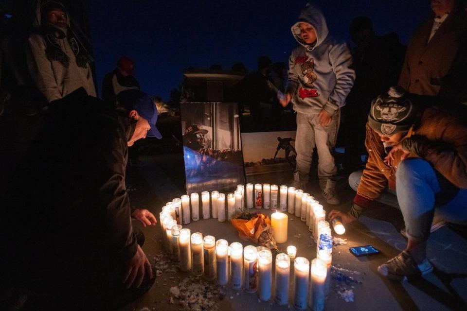 Soquoia Green, a cousin of Tyre Nichols, lights candles with family and friends during a Monday vigil at Regency Skate Park in Sacramento, where Tyree used to skateboard.