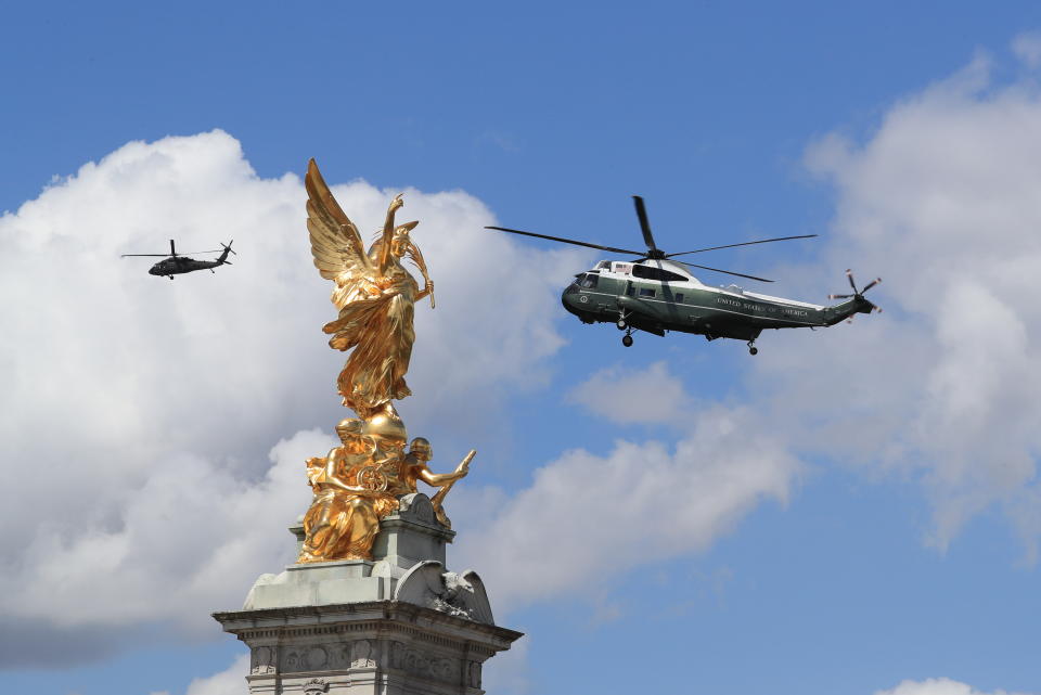 US presidential helicopters pass the Queen Victoria Memorial outside Buckingham Palace in London, as President Donald Trump arrives to meet Queen Elizabeth II.