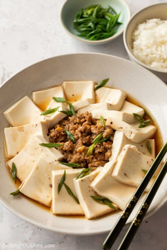 <p>Delightful Plate</p><p>Steamed tofu with ground pork features smooth silken tofu and juicy ground pork. It is light while packed with savory flavors and satisfying textures.</p><p><strong>Get the recipe: <a href="https://delightfulplate.com/steamed-tofu-with-ground-pork/" rel="nofollow noopener" target="_blank" data-ylk="slk:Steamed Tofu with Ground Pork;elm:context_link;itc:0;sec:content-canvas" class="link "><em>Steamed Tofu with Ground Pork</em></a></strong></p>