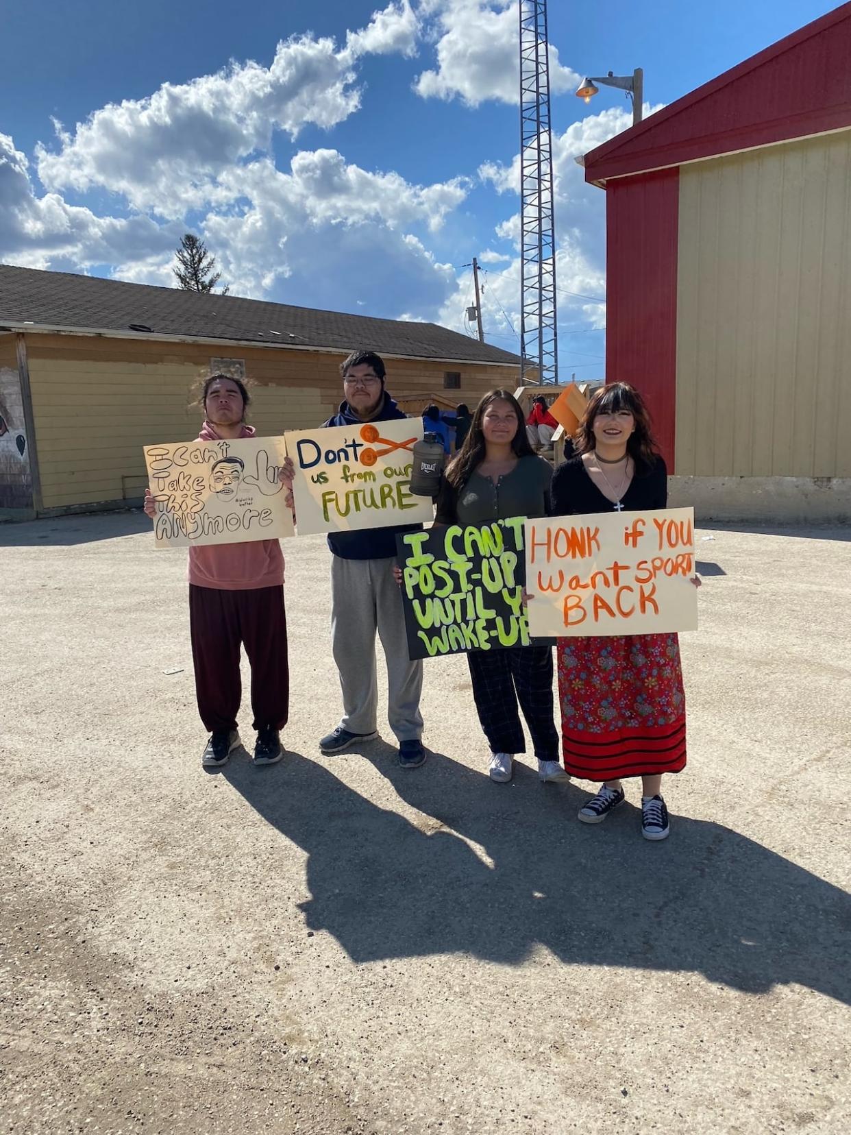 Students at Ministik community school in Cumberland House Cree nation hold a protest to bring awareness of the impacts northern students are facing due to the on-going dispute between the STF and provincial government. (Submitted by Raven Chaboyer - image credit)