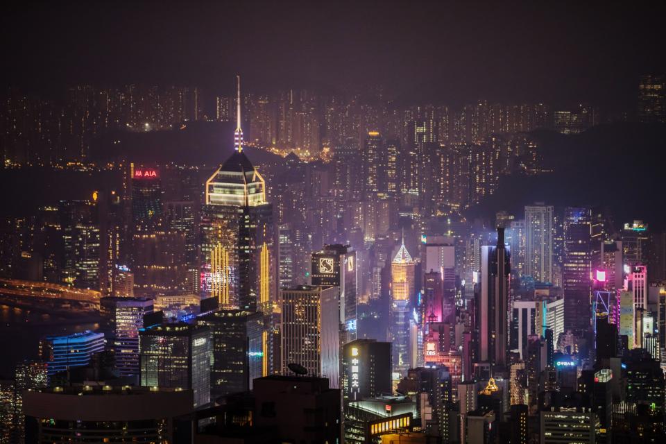 Buildings are seen from Victoria Peak at night in Hong Kong, China, on Wednesday, Aug. 28, 2019. (Photographer: Paul Yeung/Bloomberg)