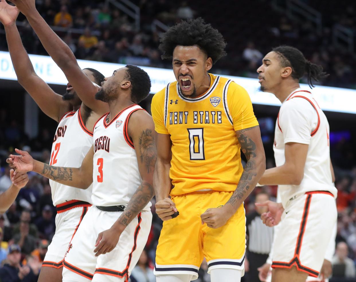 Kent State Golden Flashes guard Julius Rollins (0) flexes after making a shot during the second half of an NCAA college basketball game against the Bowling Green Falcons in the semifinals of the Mid-American Conference Tournament at Rocket Mortgage FieldHouse, Friday, March 15, 2024, in Cleveland, Ohio.