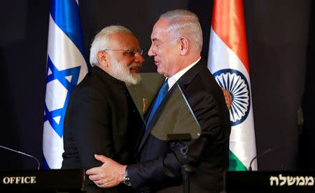 Indian Prime Minister Narendra Modi hugs with Israeli Prime Minister Benjamin Netanyahu as they deliver joint statements during an exchange of co-operation agreements ceremony in Jerusalem July 5, 2017. REUTERS/Amir Cohen