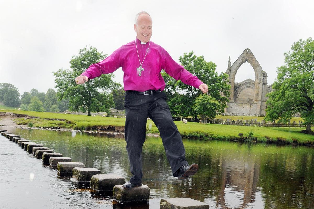 Bishop of Leeds Nick Baines tackling the stepping stones in June, 2011 <i>(Image: Stephen Garnett)</i>