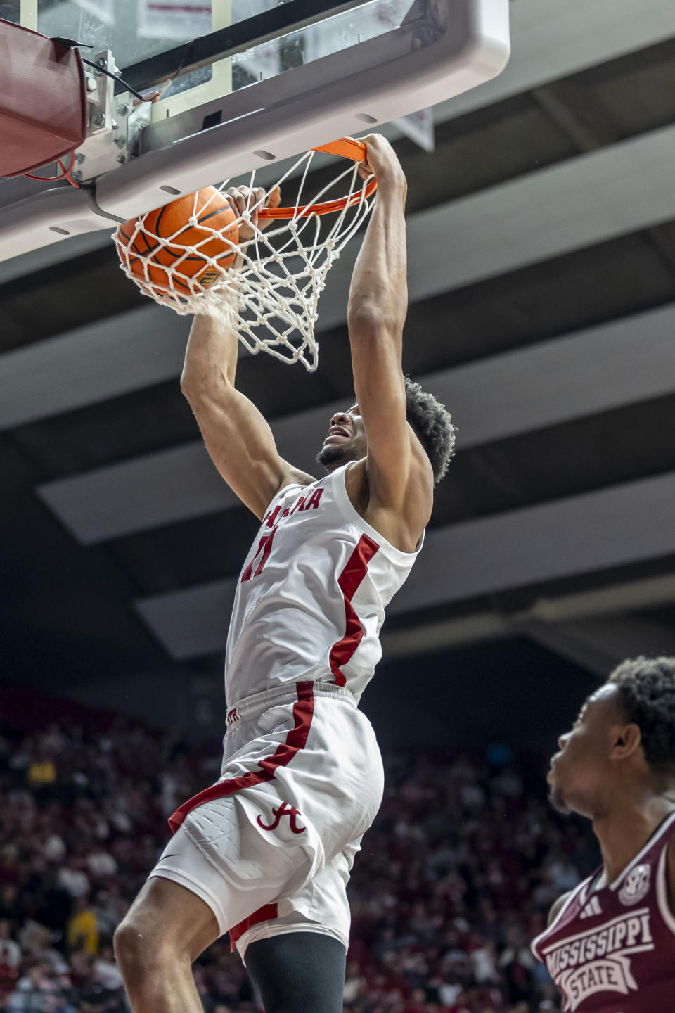 Alabama forward Mohamed Wague (11) dunks the ball for two points against Mississippi State during the first half of an NCAA college basketball game, Saturday, Feb. 3, 2024, in Tuscaloosa, Ala. (AP Photo/Vasha Hunt)