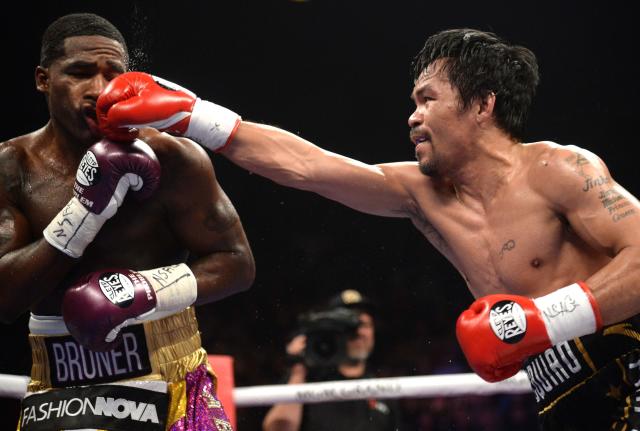 Manny Pacquiao lands a punch vs. Adrien Broner in their WBA welterweight title match at MGM Grand Garden Arena. Pacquiao won via unanimous decision. (USA Today Sports)