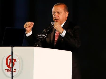 Turkey's President Tayyip Erdogan addresses his supporters during a ceremony marking the first anniversary of the attempted coup in front of the Turkish Parliament in Ankara, Turkey July 16, 2017. REUTERS/Umit Bektas