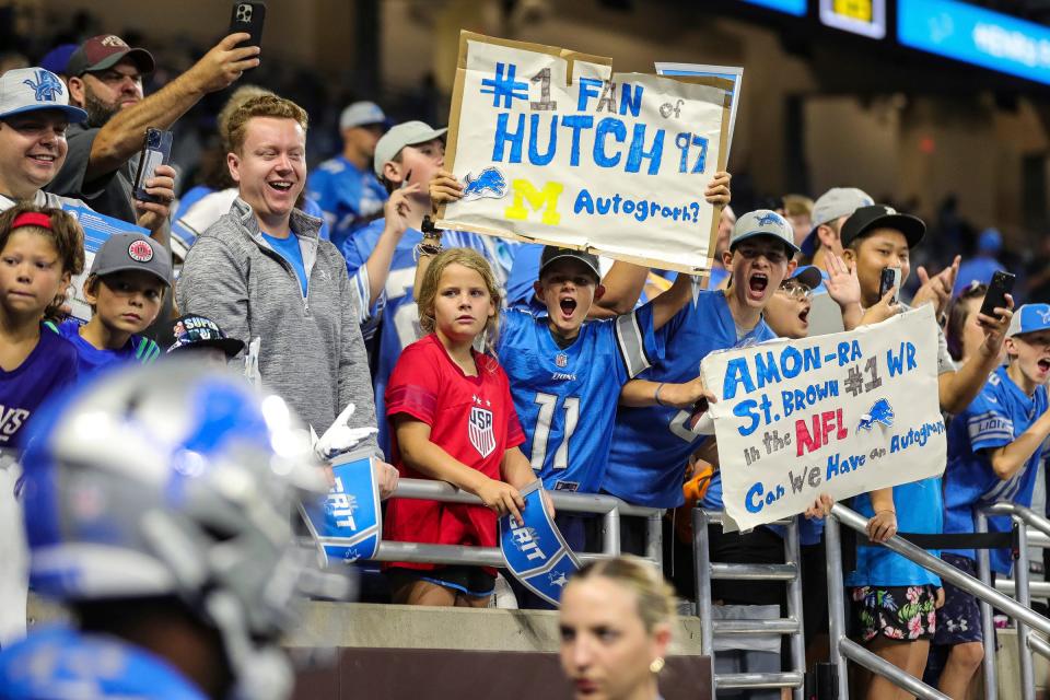 Lions fans cheer as players enter the field for warm up before a preseason game against the Giants at Ford Field on Friday, Aug. 11, 2023.