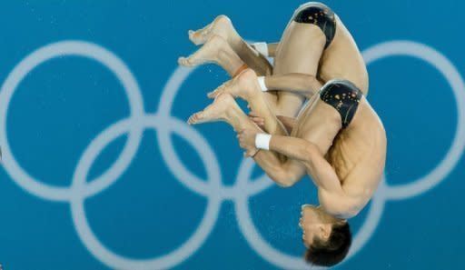 China's Cao Yuan and Zhang Yanquan compete in the men's synchronised 10m platform final diving event in the London 2012 Olympic Games at the Olympic Park on July 30, 2012