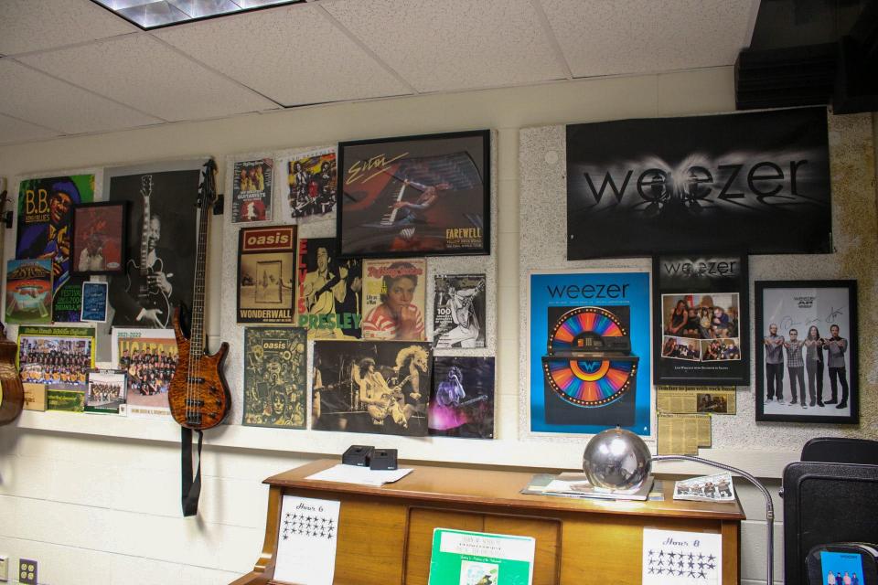 Several posters and memorabilia of popular musicians have accumulated on the walls of Matt Gerry's classroom.