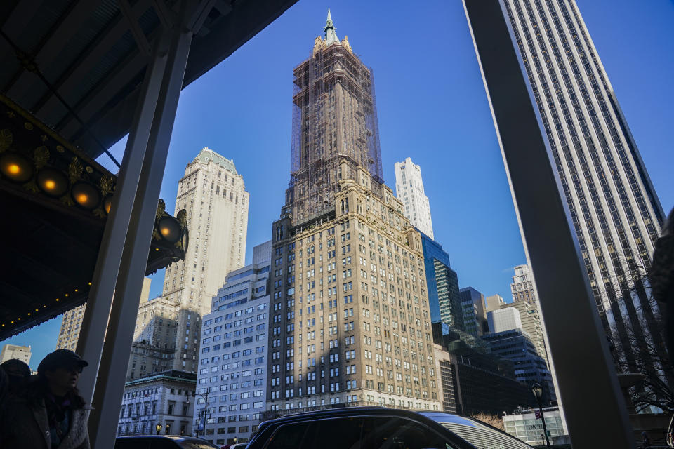 The Sherry Netherland hotel, center, is shown after an earlier fire on the same floor as the penthouse residence of Chinese businessman Guo Wengui, who has been arrested on charges alleging that he oversaw a $1 billion fraud conspiracy, Wednesday March 15, 2023, in New York. (AP Photo/Bebeto Matthews)