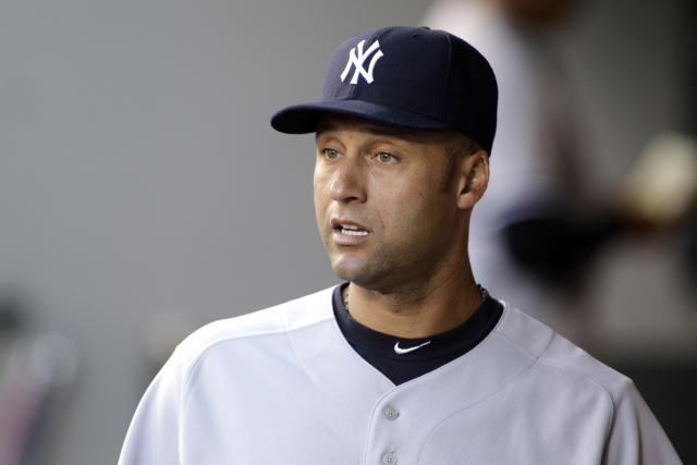 New York Yankees Derek Jeter walks through the dugout during the