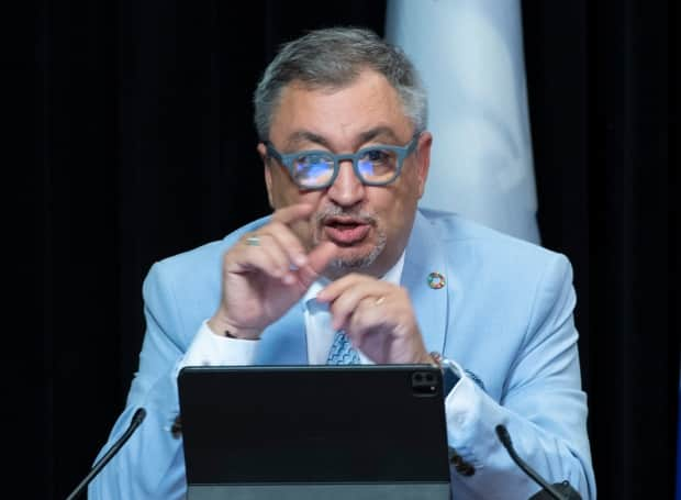 Dr. Horacio Arruda, Quebec's director of public health, defended the decision to gather personal information and said it would be destroyed at the end of the year. (Jacques Boissinot/The Canadian Press - image credit)