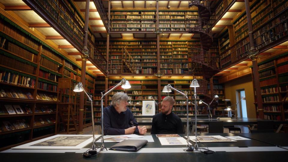 Stephen Fry looking through art in Rijksmuseum (Atticus Film)