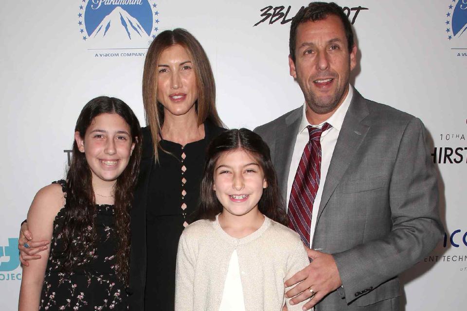 <p>MediaPunch/Shutterstock </p> Adam Sandler, wife Jackie and daughters Sadie and Sunny in 2019