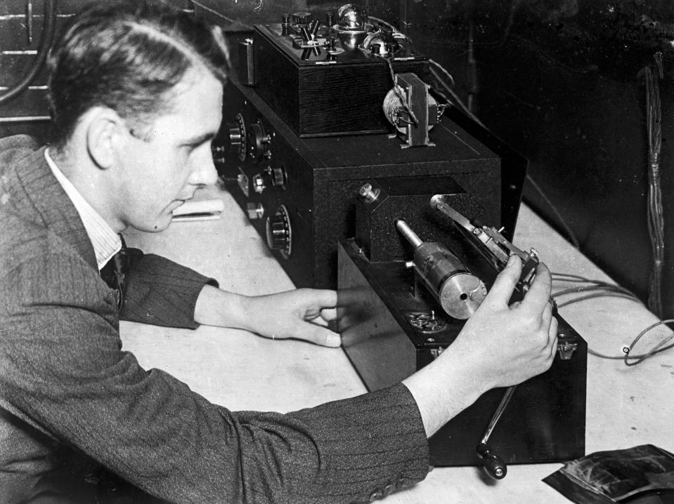 Transmitting the first radio picture of His Majesty King George V using a Fultograph machine, a clockwork-driven image receiving device. Signals were transferred to the 76 miles of land line connecting the BBC Headquarters at Savoy Hill with the Daventry Station.