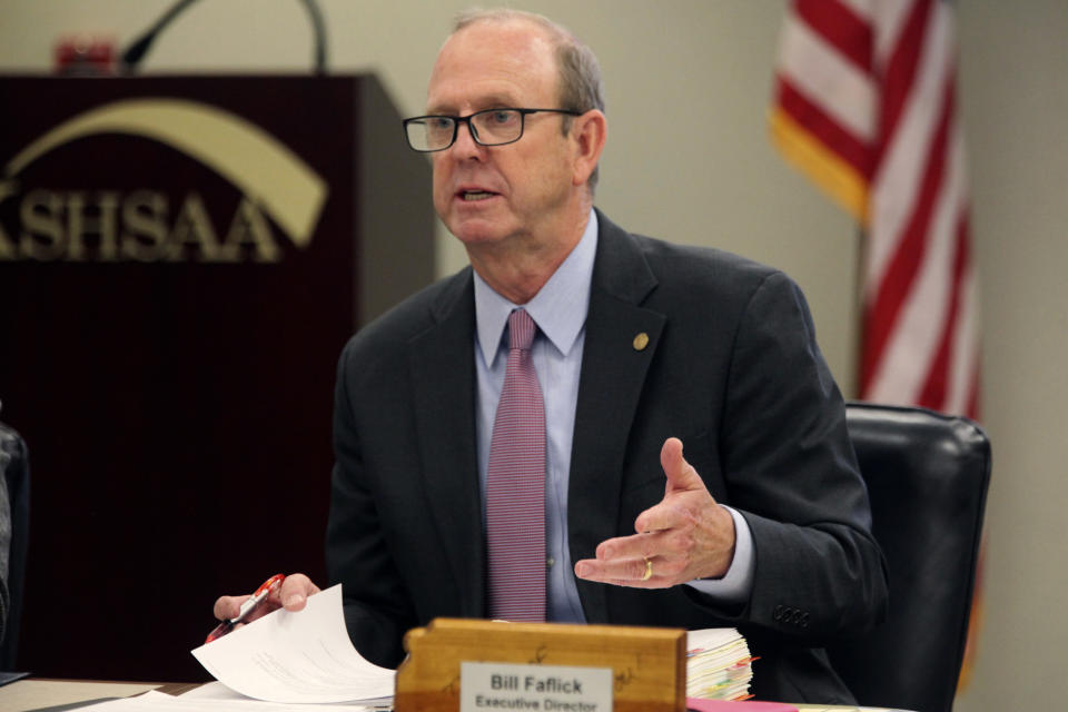 Bill Faflick, the executive director of the Kansas State High School Activities Association, speaks during a meeting of its executive board, Wednesday, April 26, 2023, in Topeka, Kansas. The board approved a new policy for settling questions about transgender athletes in line with the state's new ban on transgender female athletes in girls' and women's sports. (AP Photo/John Hanna)