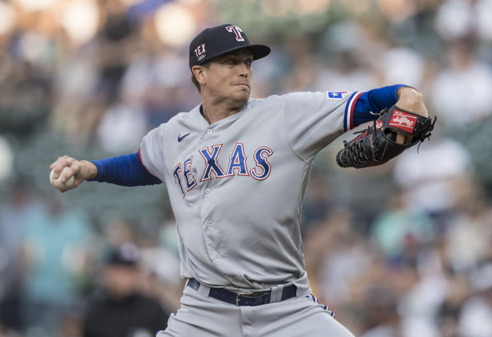 FILE - In this , Friday, July 2, 2021 file photo, Texas Rangers starter Kyle Gibson delivers a pitch during the first inning of a baseball game against the Seattle Mariners, in Seattle. There is quite a Texas trio unexpectedly going to the All-Star Game together. The Texas Rangers will send right-hander Kyle Gibson and big-hitting outfielders Joey Gallo and Adolis Garcia to Denver for the game Tuesday, July 13, 2021. (AP Photo/Stephen Brashear, File)