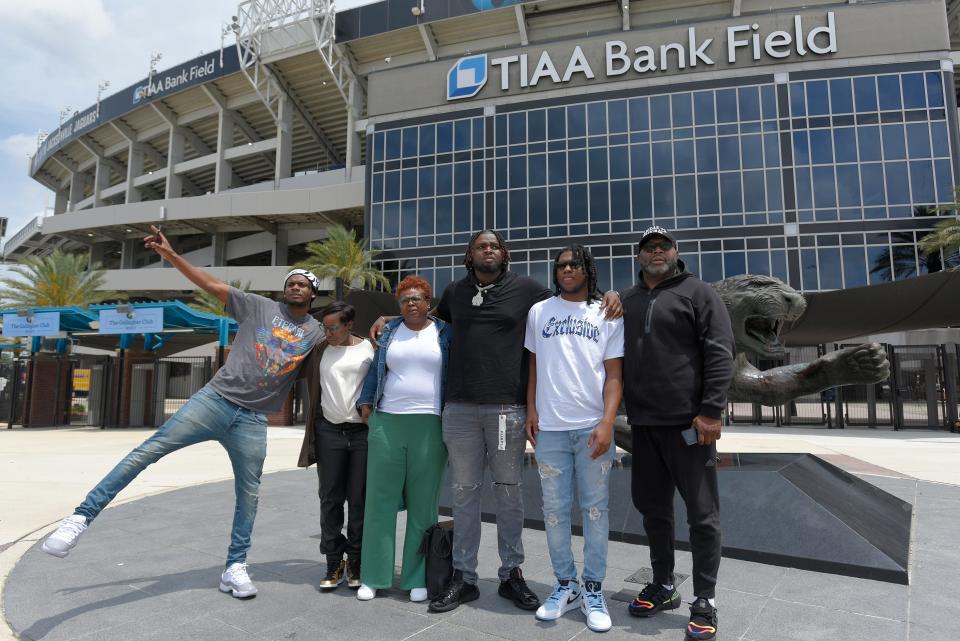 Anton Harrison poses for a photo with his brother Donte Harrison, aunt Harriet Wiley, mother Crystal Wiley, brother Mehki Moore and father Andre Harrison in front of the Jaguar statue outside TIAA Bank Field early Friday afternoon. Anton Harrison arrived with his family as he made his first visit at TIAA Bank Field in Jacksonville, FL after being flown down from the Washington, DC area Friday, April 28, 2023. Harrison, an offensive tackle from the University of Oklahoma, became the Jacksonville Jaguars' first round selection in the 2023 NFL Draft, being the 27 overall pick late Thursday night.