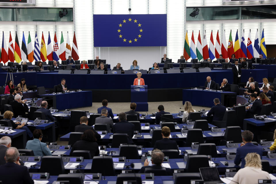 European Commission President Ursula von der Leyen, center, speaks during a commission on Russia's escalation of its war of aggression against Ukraine, at the European Parliament, Wednesday, Oct. 5, 2022, in Strasbourg, eastern France. (AP Photo/Jean-Francois Badias)