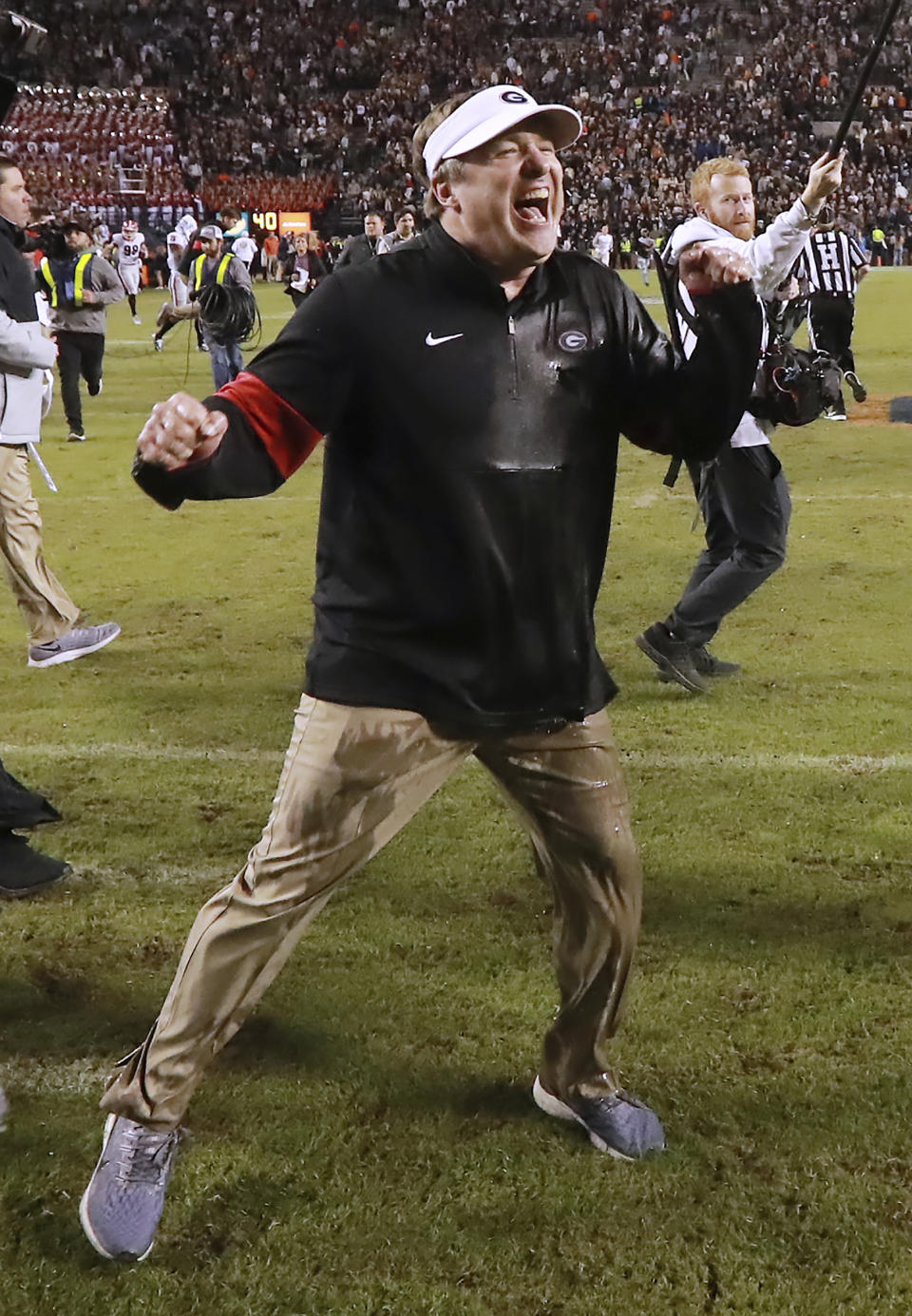 Georgia head coach Kirby Smart celebrates as time expires for a 21-14 victory over Auburn in an NCAA college football game, Saturday, Nov. 16, 2019, in Auburn, Ala. (Curtis Compton/Atlanta Journal-Constitution via AP)