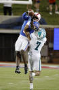 SMU wide receiver Danny Gray (5) makes a catch over Tulane defensive back Lance Robinson (7) during the second half of an NCAA college football game in Dallas, Thursday, Oct. 21, 2021. (AP Photo/Michael Ainsworth)