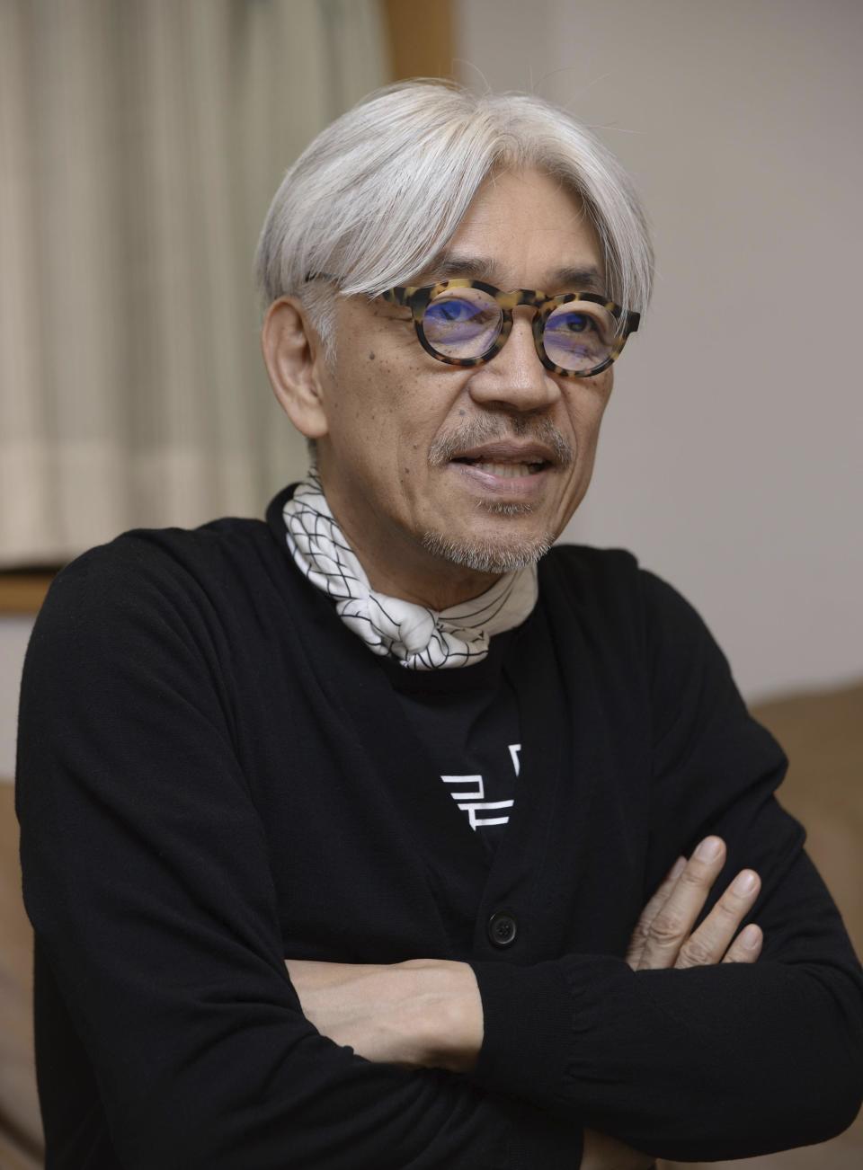 Ryuichi Sakamoto speaks in an interview in Tokyo, Japan, March, 2017. Japan's recording company Avex says Sakamoto, a musician who scored for Hollywood movies such as “The Last Emperor” and “The Revenant,” has died. He was 71. He died March 28, according to the statement released Sunday, April 2, 2023. (Kyodo News via AP)