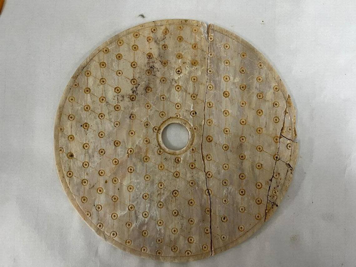 The talc disk, or bi, found in one of the tombs.