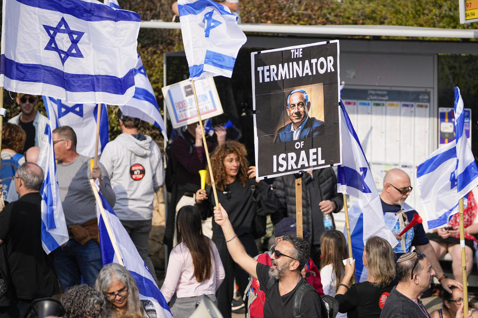 Israelis protest against plans by Prime Minister Benjamin Netanyahu's new government to overhaul the judicial system outside the Knesset, Israel's parliament in Jerusalem, Monday, Feb. 20, 2023. Israel's government is pressing ahead with its contentious plan to overhaul the country's legal system. A vote in parliament on Monday is due despite an unprecedented uproar that has included mass demonstrations, warnings from military and business leaders and calls for restraint from the U.S. (AP Photo/Ohad Zwigenberg)