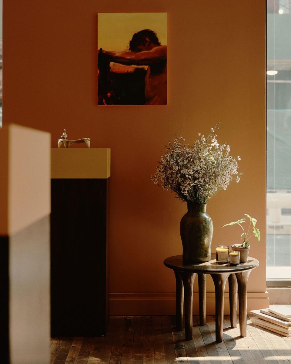 a vase with flowers on a table