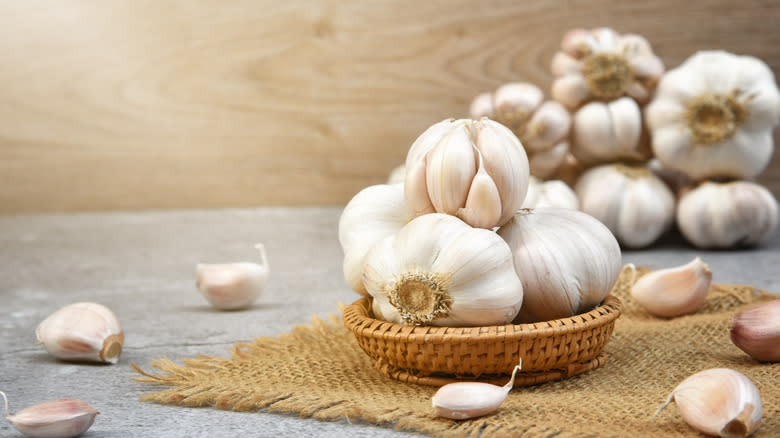 Garlic bulbs in wood bowl