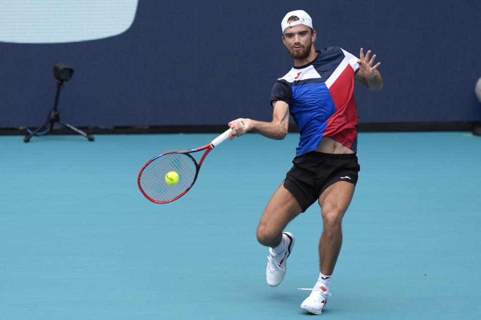 Tomas Machac, of the Czech Republic, this a return to Jannik Sinner, of Italy, during the Miami Open tennis tournament, Wednesday, March 27, 2024, in Miami Gardens, Fla. (AP Photo/Lynne Sladky)