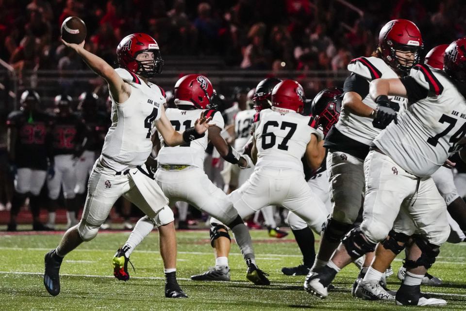 Oak Hills quarterback Jaxon Schreiber (4) passes during the fourth quarter of a high school football game with Lakota West  Friday, Sept. 9, 2022.