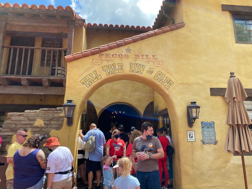 A crowd gathers at Pecos Bill Tall Tale Inn & Cafe at Disney World.