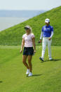 Anna Nordqvist, left, and Haru Nomura, of Japan, walk down the hill from the 17th tee during the LPGA Tour golf tournament at Kingsmill Resort, Thursday, May 23, 2019, in Williamsburg, Va. (John Sudbrink/The Daily Press via AP)