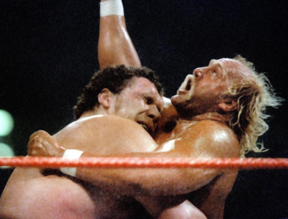 Andre the Giant bearhugs Hulk Hogan at Wrestlemania 3