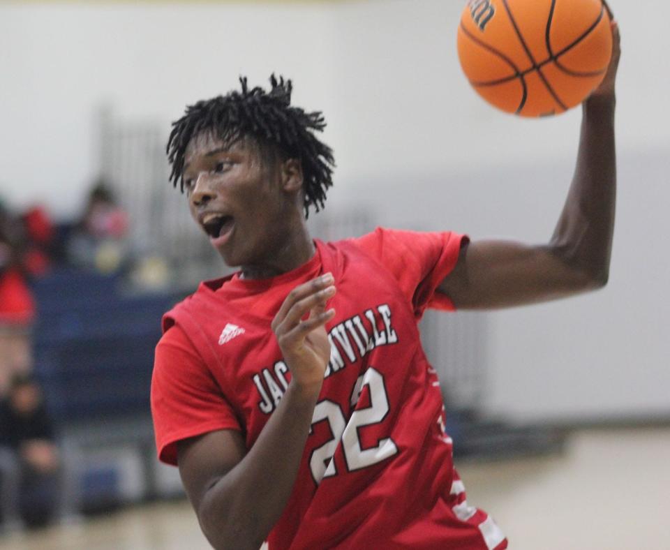 Jacksonville's Ra-Shawn Echols grabs a rebound Thursday against Northside.