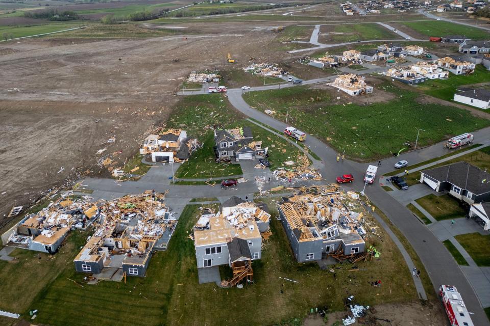 Damaged houses are seen after a tornado passed through the area near Omaha, Neb., on Friday, April 26, 2024. (Chris Machian/Omaha World-Herald via AP)