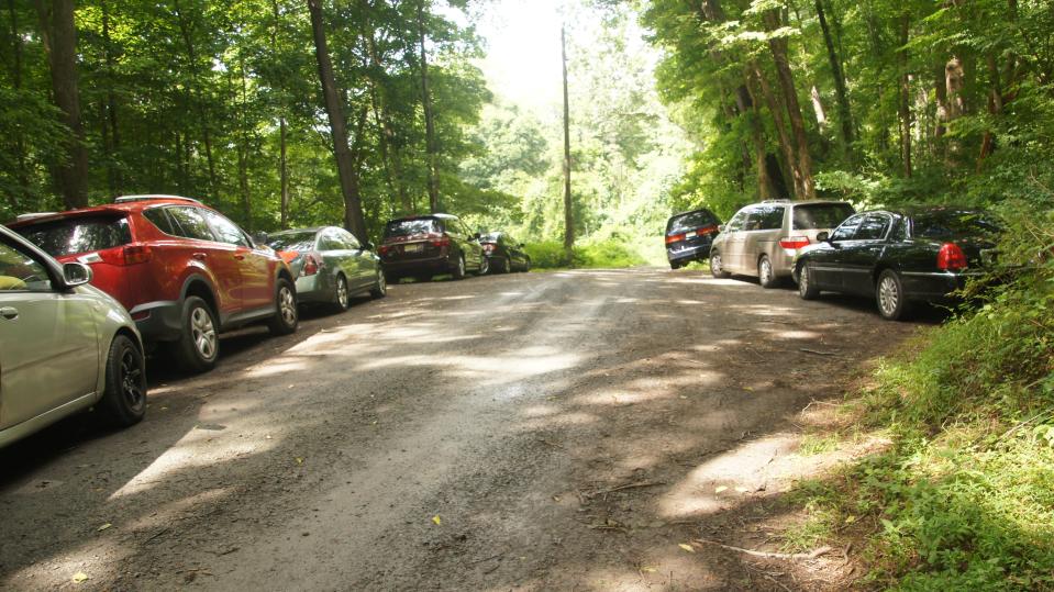 Cars parked by hikers along Old Mine Road. The centuries-old route along the Delaware River will be repaired and rebuilt in an $11 million overhaul starting this spring.