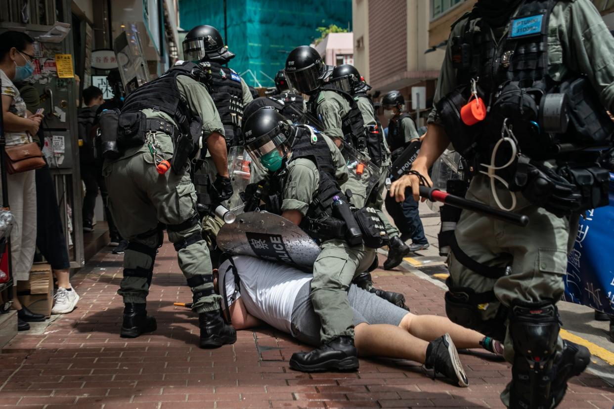 A man is detained by riot police during a demonstration in Hong Kong: Getty Images