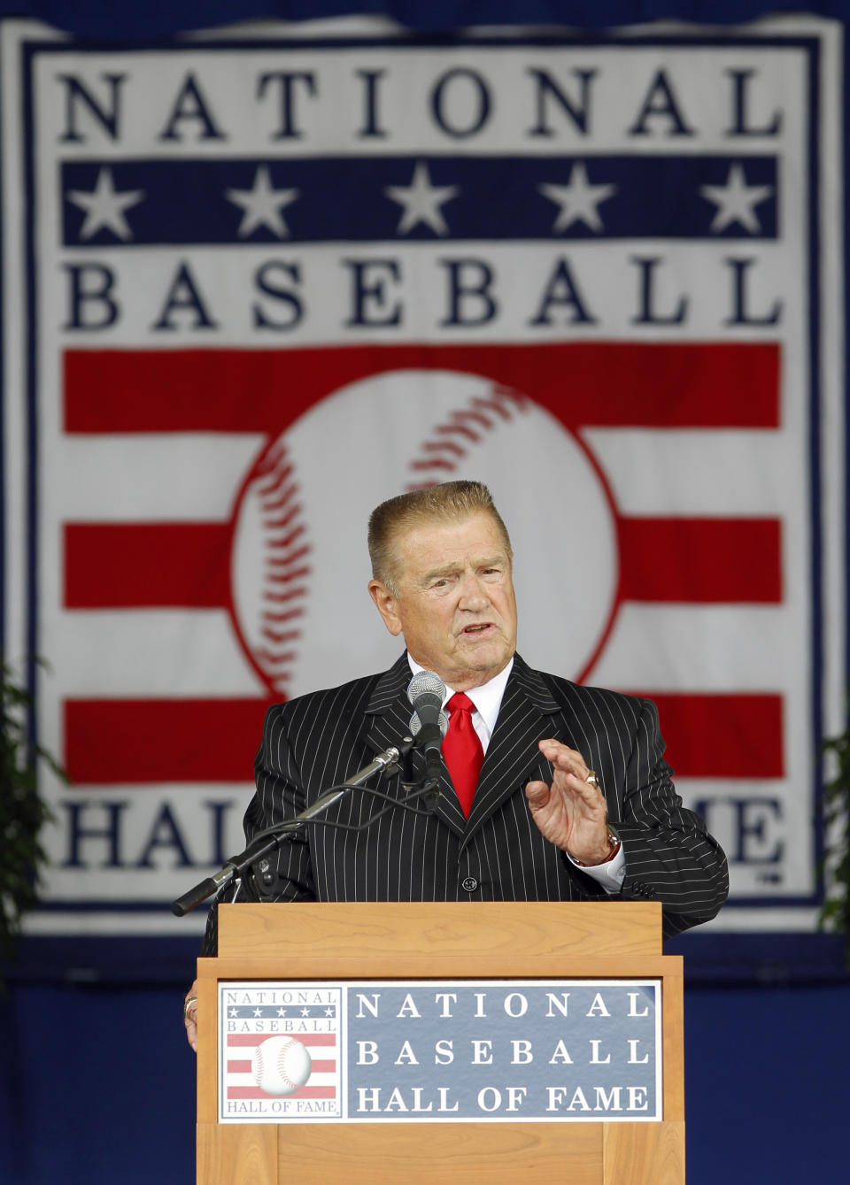 FILE - Whitey Herzog delivers his Baseball Hall of Fame induction speech at the Clark Sports Center in Cooperstown, N.Y., on Sunday, July 25, 2010. Herzog, the gruff and ingenious Hall of Fame manager who guided the St. Louis Cardinals to three pennants and a World Series title in the 1980s and perfected an intricate, nail-biting strategy known as "Whiteyball," has died. He was 92. Cardinals spokesman Brian Bartow said Tuesday, April 16, 2024, the team had been informed of his death by Herzog's family.(AP Photo/Mike Groll, File)