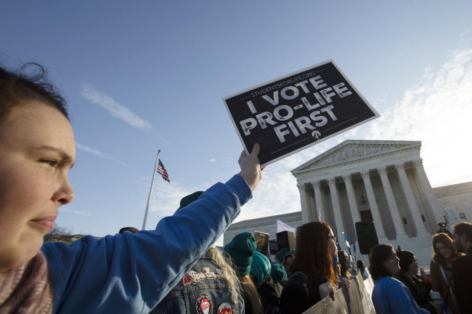 Anti-abortion demonstrators rally outside of the U.S. Supreme Court in Washington, Wednesday, March 4, 2020. The Supreme Court is taking up the first major abortion case of the Trump era Wednesday, an election-year look at a Louisiana dispute that could reveal how willing the more conservative court is to roll back abortion rights. (AP Photo/Jose Luis Magana)
