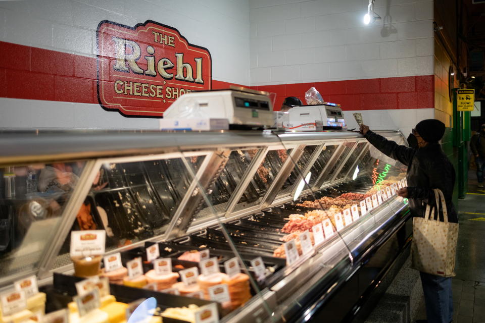 A customer shops at a deli in Reading Terminal Market after the inflation rate hit a 40-year high in January, in Philadelphia, Pennsylvania, U.S. February 19, 2022. REUTERS/Hannah Beier