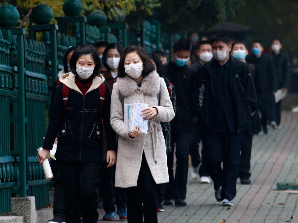 Schoolchildren wearing face mask, go to the Kumsong Secondary School No. 2 in the morning in Pyongyang, North Korea, on Wednesday, Nov. 3, 2021.