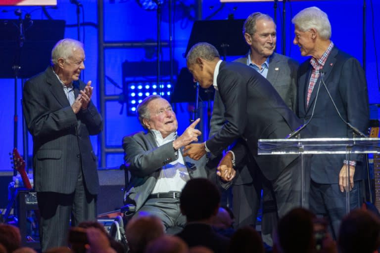 (L-R) Former US presidents Jimmy Carter, George H.W. Bush, Barack Obama, George W. Bush and Bill Clinton attend a hurricane relief concert in Texas in October 2017