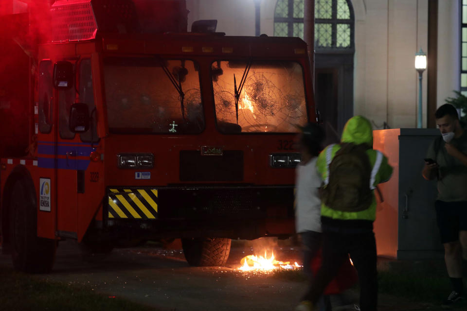 Aug 23, 2020; Kenosha, WI, USA; A city truck is on fire outside the Kenosha County Courthouse in Kenosha on Sunday, Aug. 23, 2020. Kenosha police shot a man Sunday evening, setting off unrest in the city after a video appeared to show the officer firing several shots at close range into the man's back. Mandatory Credit: Mike De Sisti/Milwaukee Journal Sentinel via USA TODAY NETWORK/Sipa USA