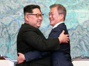 <p>North Korean leader Kim Jong Un, left, and South Korean President Moon Jae-in embrace each other after signing on a joint statement at the border village of Panmunjom in the Demilitarized Zone, South Korea, Friday, April 27, 2018. (Photo: Korea Summit Press Pool via AP) </p>